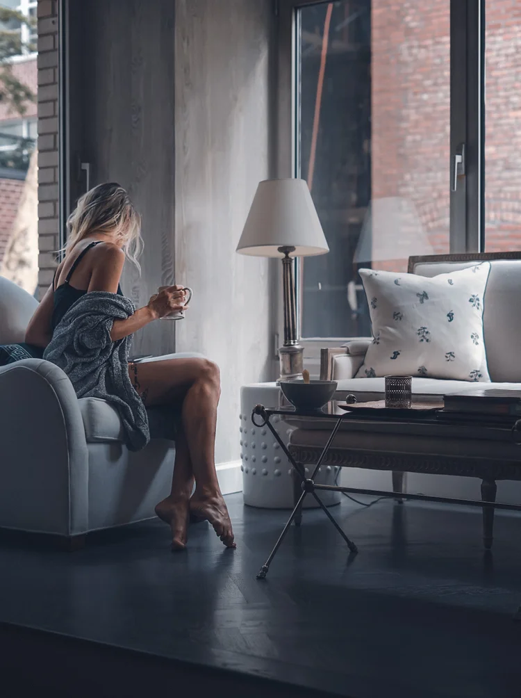 Woman relaxing in a beautifully appointed living room